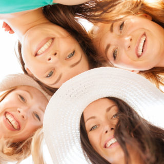 women-smiling-in-circle