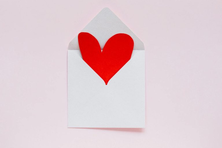 Valentine's Day Messages - red heart coming out of envelope