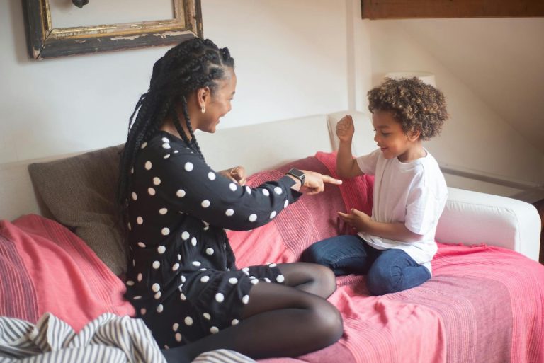 The perfect mom - Mom playing games with her son on bed