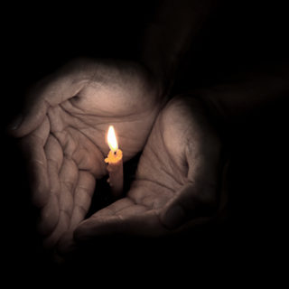 candle-hands-prayer