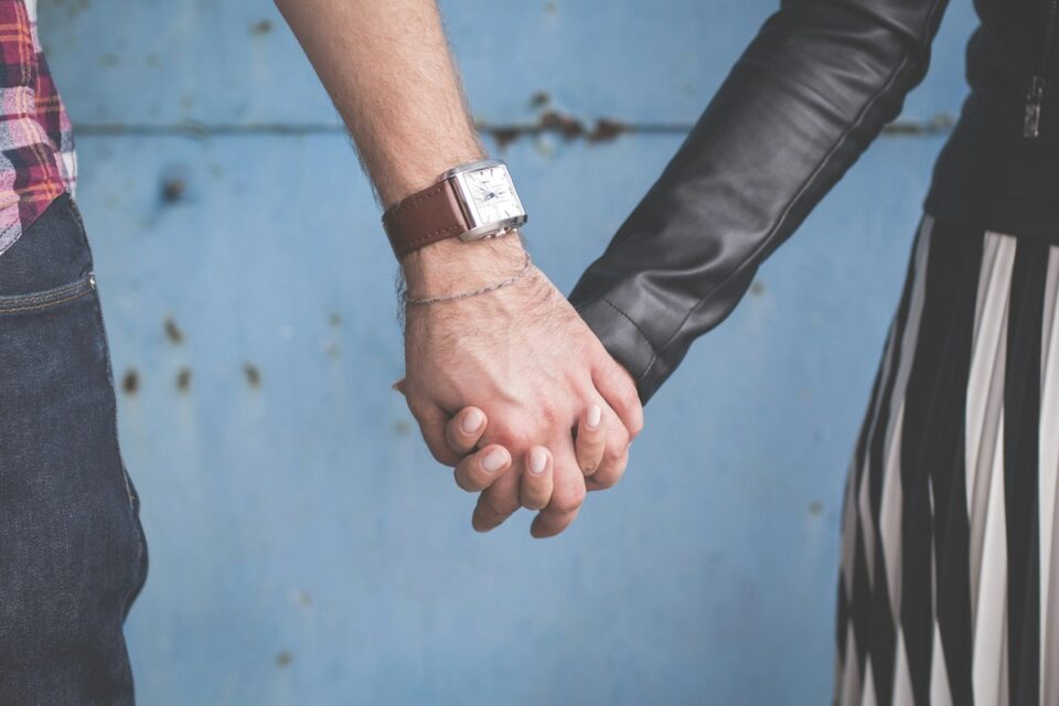 Man and woman holding hands married