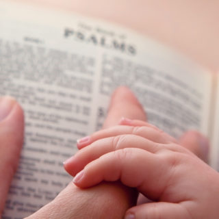 Bible-baby-hand