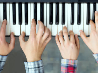 two-boys-playing-piano