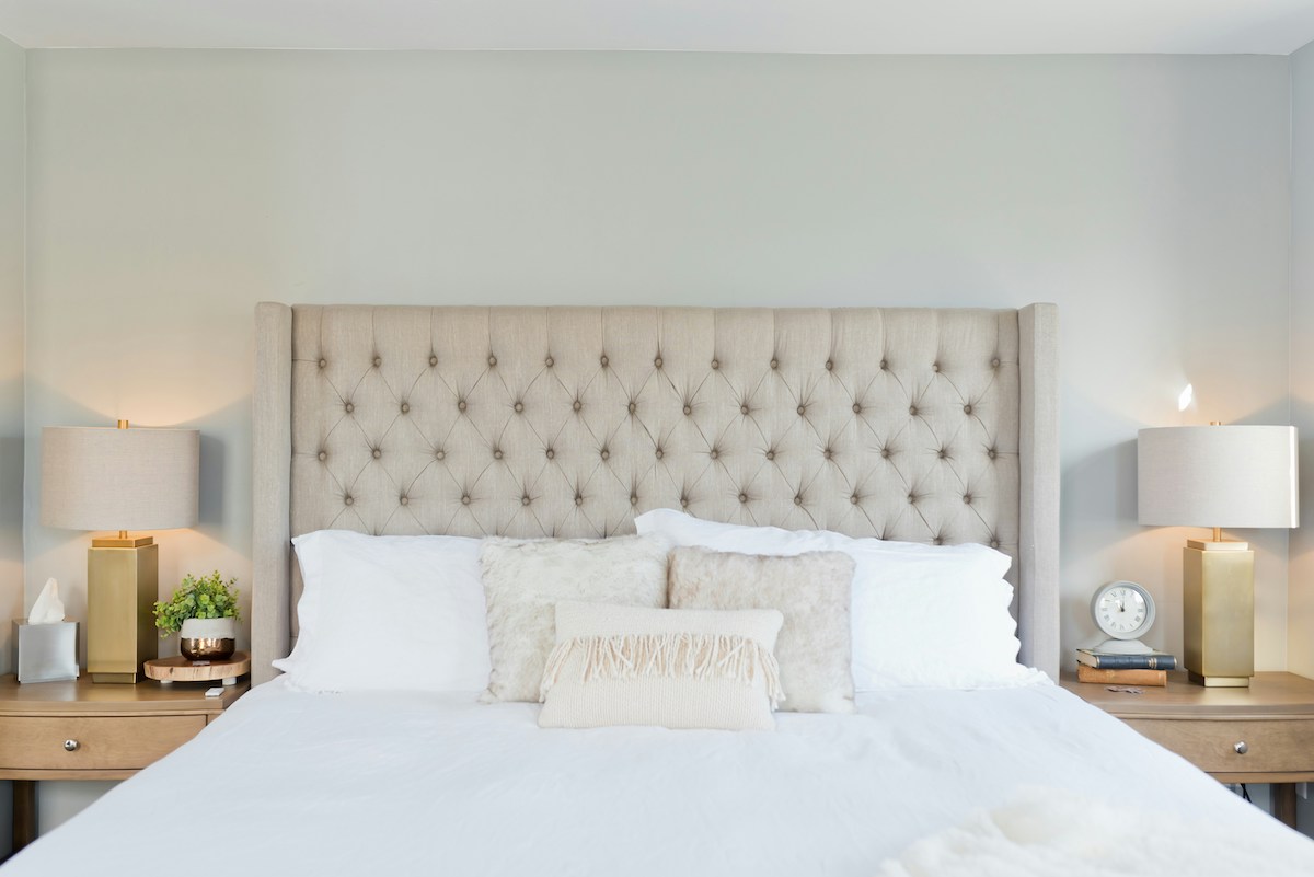 White bedroom with pillows on bed