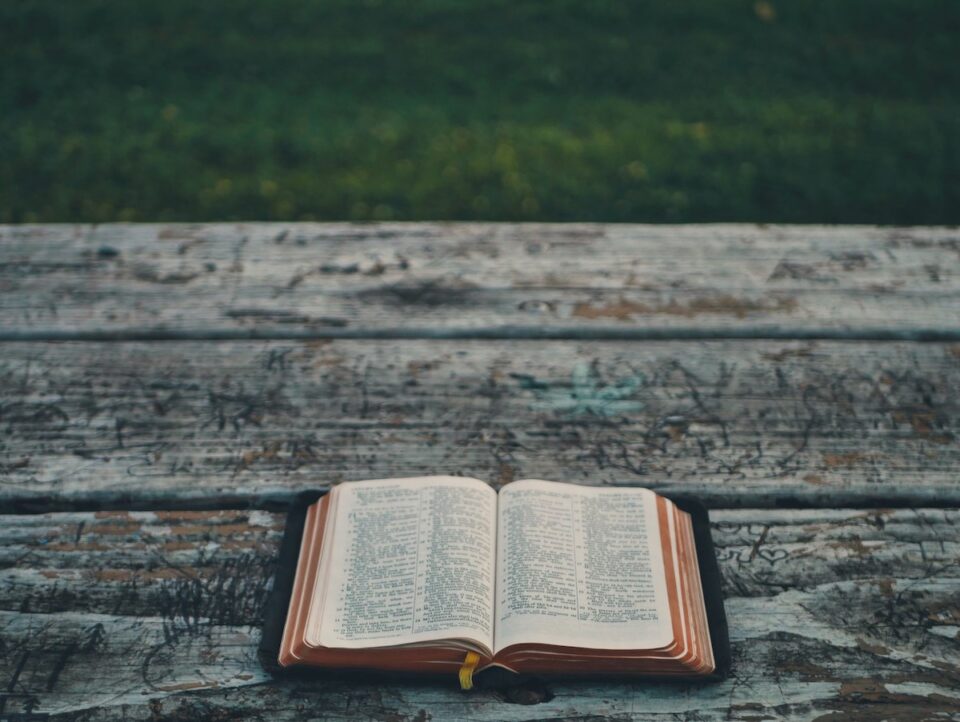 Bible laying open on a table outside