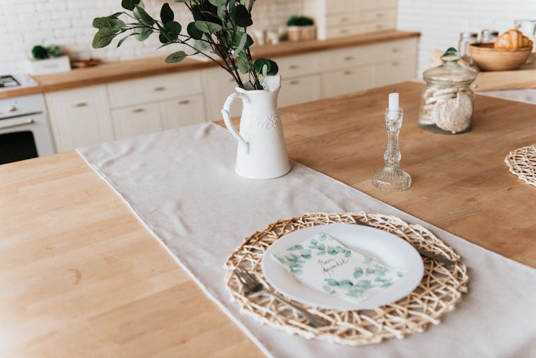 A stylish dining table with floral decor, perfect for a cozy indoor atmosphere in a home kitchen.
