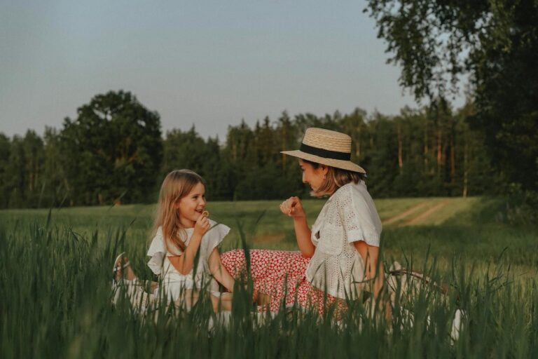 Mom having a summer full of fun with her kids picnic outdoors