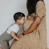 13 powerful posts to encourage moms of littles - Boy kissing mom's belly