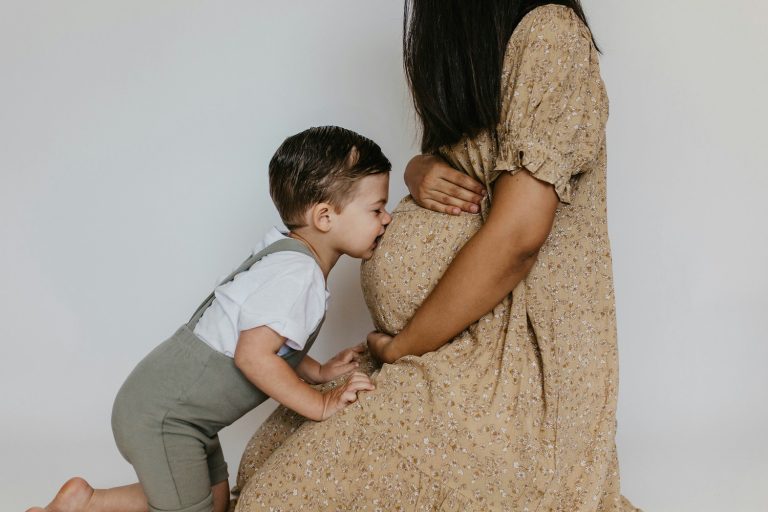 13 powerful posts to encourage moms of littles - Boy kissing mom's belly
