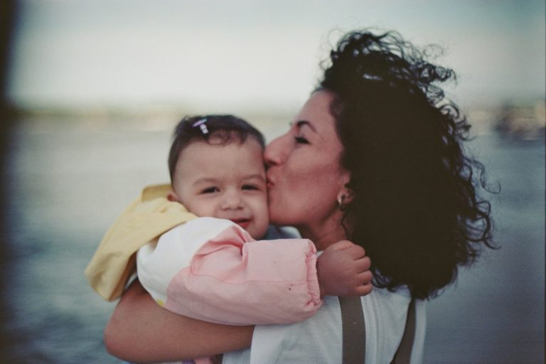 Encouraging bible verses for moms - Mother kissing baby's cheek