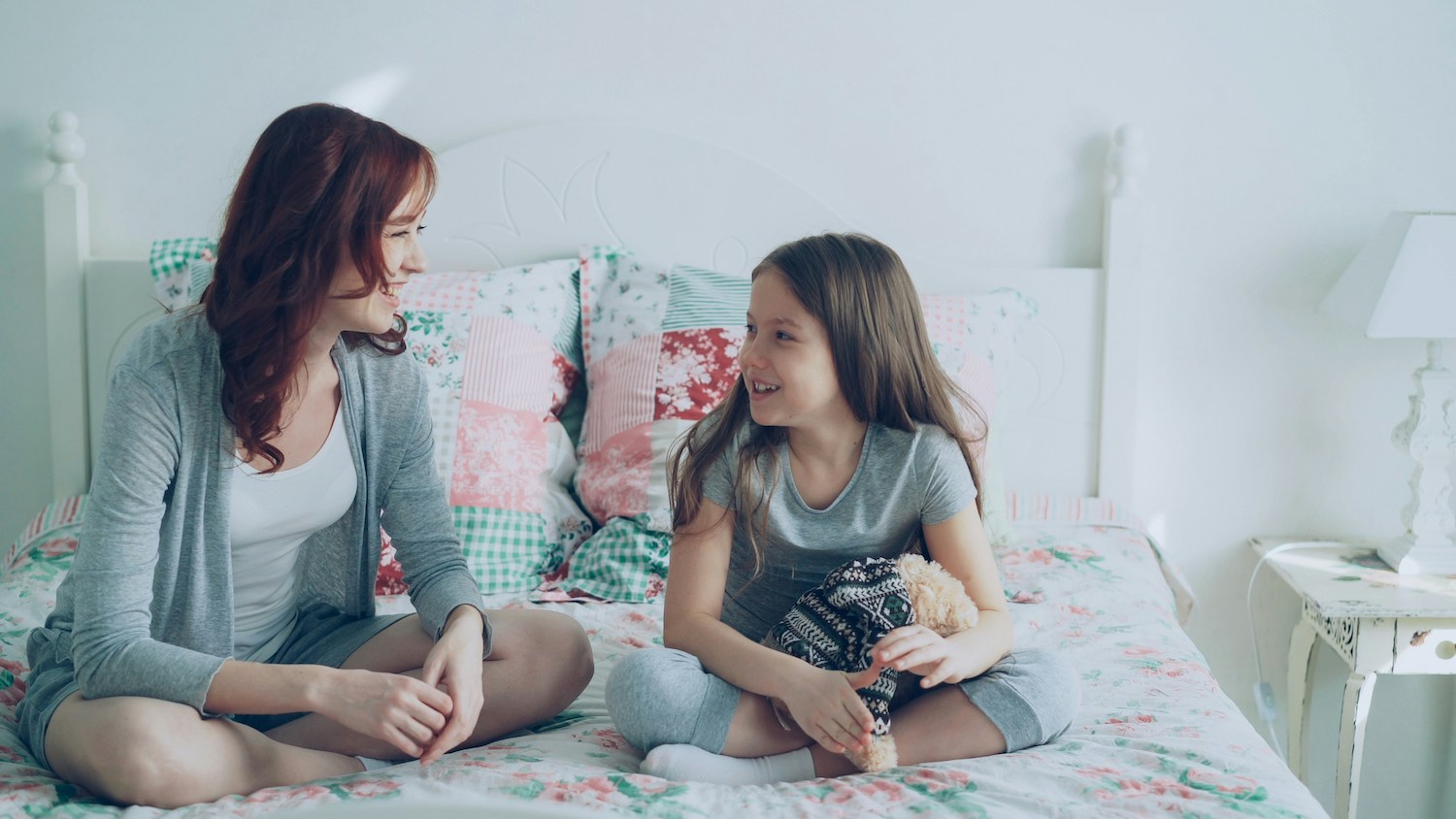 Questions to Ask Your Kids - mom and daughter talking on bed