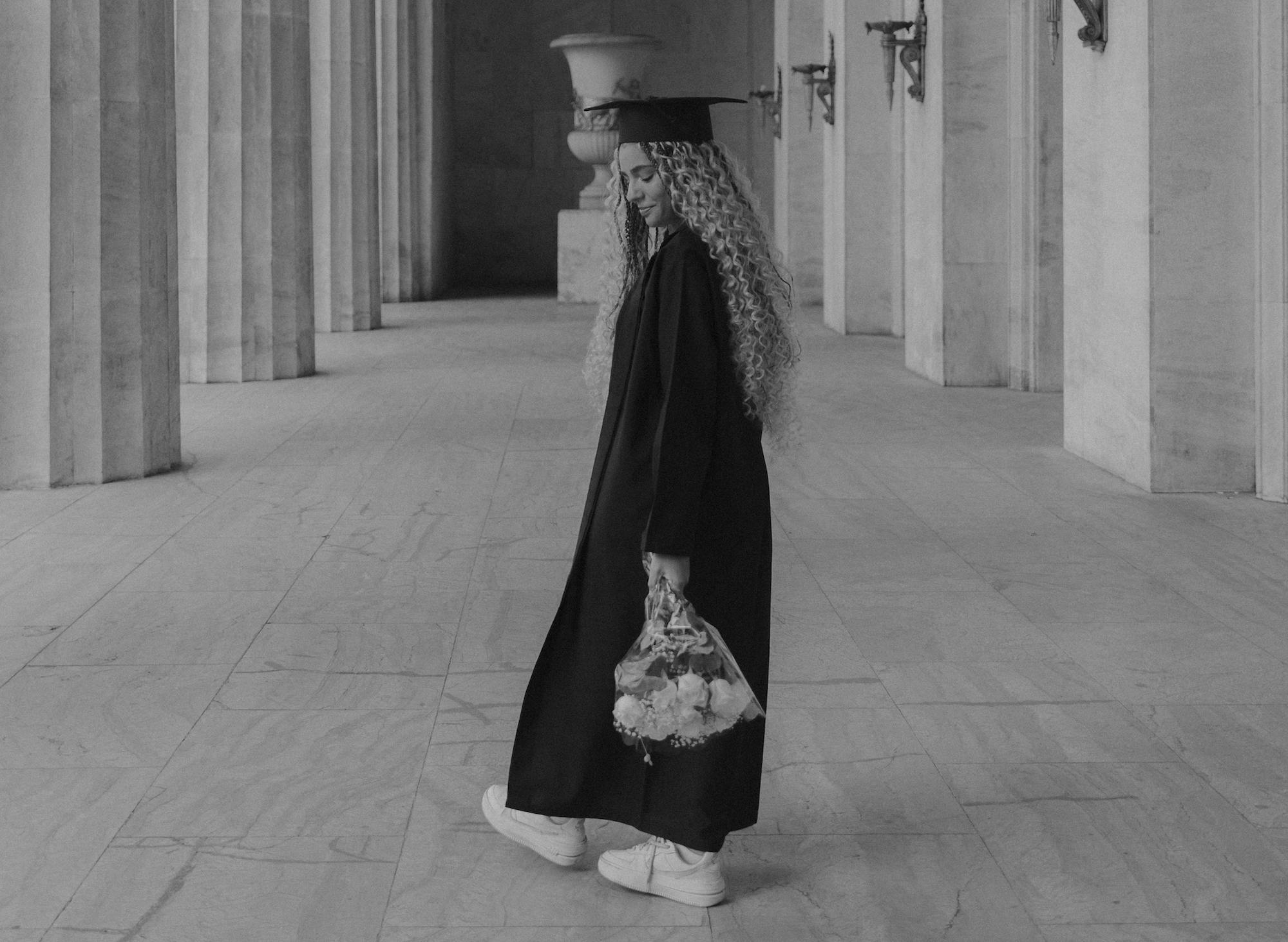 Young graduate girl with flowers - Grief When Children Graduate High School